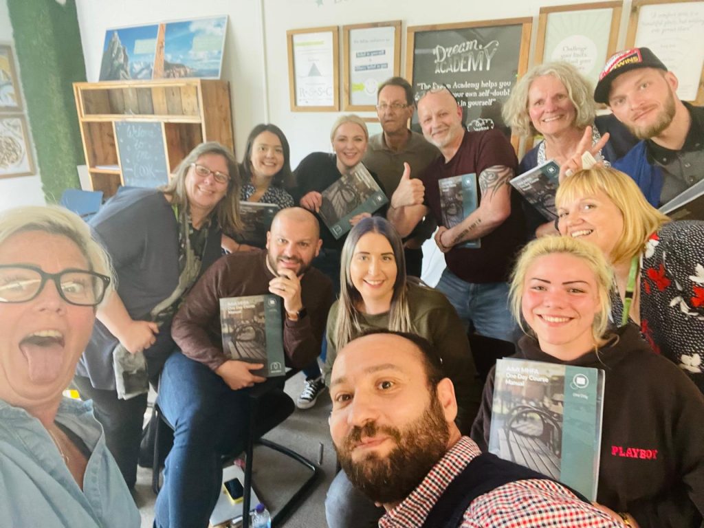 BTG Training course group with Mental Health First Aid materials